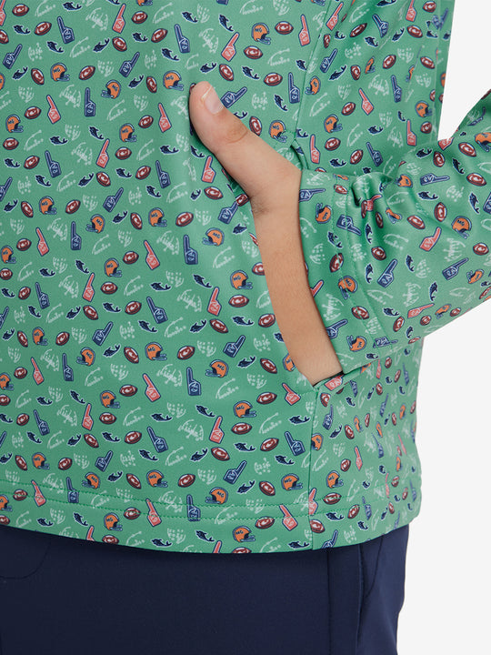 Model with both hands in pockets wearing youth full print stylish hoodies pullover in green rugby.