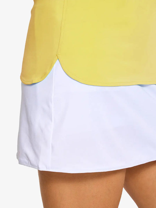 Detail shot of side hem opening on YELLOW Women's Performance Solid Polo