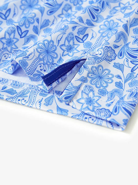 MAELREG's hem slit detail showcases the WHITE PAISLEY Polo shirt. Its refined craftsmanship and fabric texture highlight its high quality