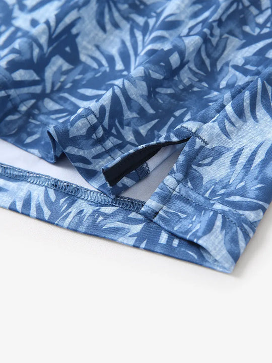 Hem slit detail of BLUE LEAF Performance Quick Dry Print Golf Polo highlighting stitching and finish