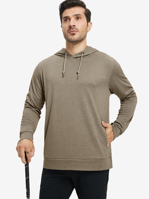 Model with one hand in pocket, wearing classic heather pullover hoodie in brown melange, relaxed look.