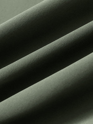 Close-up of fabric on 2 in 1 running sports shorts with liner, showing texture and finish in olive green
