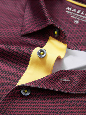 Detail shot of the collar on the burgundy geometric 4 way stretch print collared polo shirt, emphasizing the classic neckline design