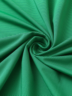 Fabric close-up of pinstripe jersey performance polo, fine stripe pattern with breathable green stripe finish