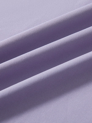 Close-up of lavender ventilated pique performance polo fabric texture.
