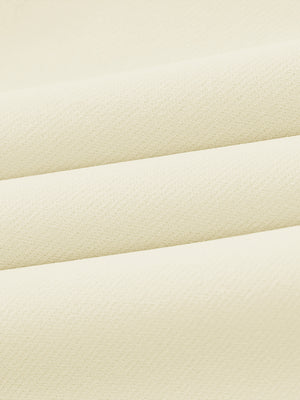 Close-up of wrinkle-resistant, sun-protective fabric on water-resistant golf stretch nylon pants in beige.
