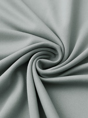 Close-up of fabric on stylish chest print snap polo, showing texture and finish in light grey.