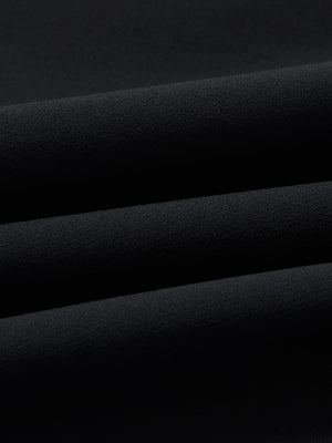 Close-up of wrinkle-resistant, sun-protective fabric on water-resistant golf stretch nylon pants in black.