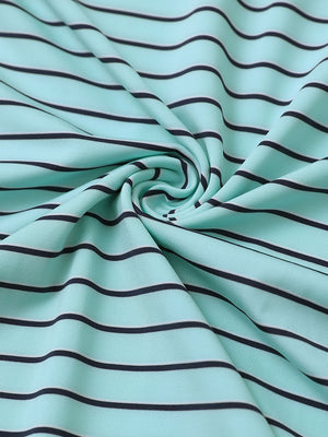 Close-up of turquoise/navy stripe popular yarn dyed stripe polo fabric showing crisp lines and soft texture.