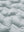Fabric close-up of boys windproof puffer jacket with pockets, highlighting texture and finish in light grey.