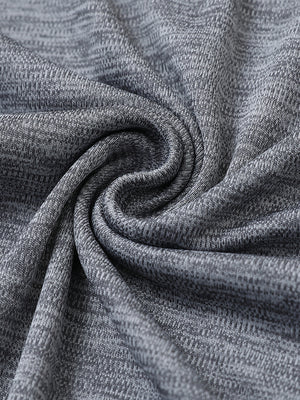 Close-up of grey heather modern fit melange polo fabric showing soft and textured surface.