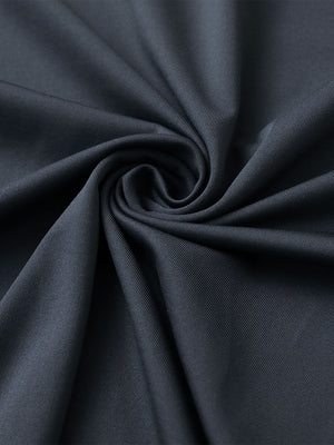 Close-up of dark grey premium performance polo fabric showing smooth texture.