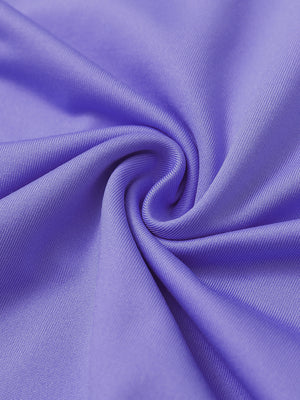 Fabric close-up of Stretch solid fleece quarter-zip vest with soft feel and lavender detail