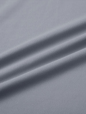 Fabric detail of Long sleeve performance solid pique polo with breathable knit in light grey
