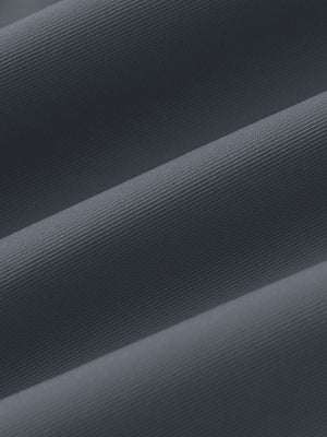 Fabric close-up of Women's 7/8 ankle golf track pants with soft texture in dark grey