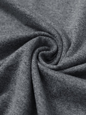 Close-up fabric detail of skin-friendly long sleeve melange polo, soft blend texture with black grey heather tone