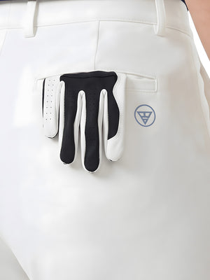Detail view of back pocket on white women's regular fit stretchy golf pants