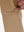 Detail view of design on light khaki  flat front golf joggers pants with belt loops