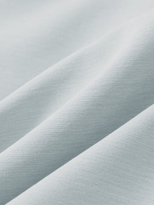 Close-up texture of newport blue flat front hybrid golf shorts fabric showing detailed hybrid material and weave.