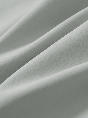 Macro view of the light grey stretch soft flat front dress golf shorts fabric, showcasing the smooth texture
