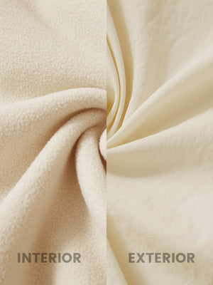 Close-up of inside and outside fabric of khaki windproof fleece reversible golf vest.