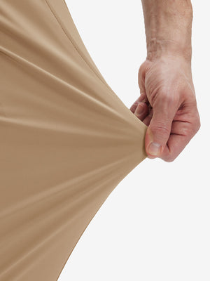 Detail view of pants elasticity on light khaki  flat front golf joggers pants with belt loops