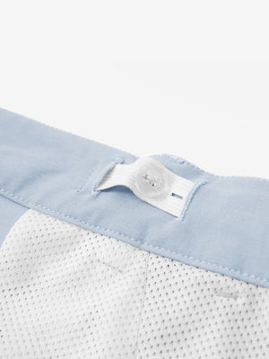 Interior shot of the waistband on the sky blue youth water resistant cotton blend golf pants, showing inner construction
