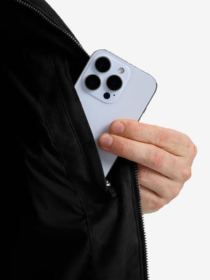 Close-up view of black classic micro suede leather puffer vest inner pocket detail