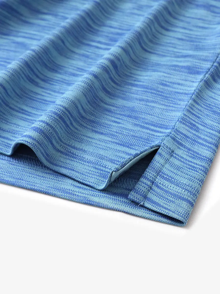 Hem slit detail close-up of the CLASSIC BLUE HEATHER Cool Heather Texture Polo