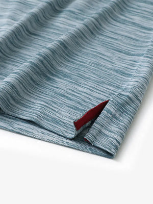 Close-up of hem slit detail in SLATE GREEN HEATHER Cool Heather Texture Polo