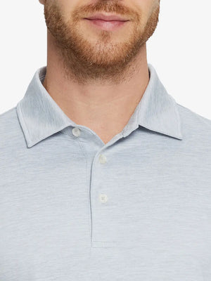 Faded Denim Heather Skin-friendly Long Sleeve Melange Polo – front view from model’s nose to chest