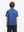 Back half-body view of youth wearing blue molecular structure performance print boys golf polo, showing rear design