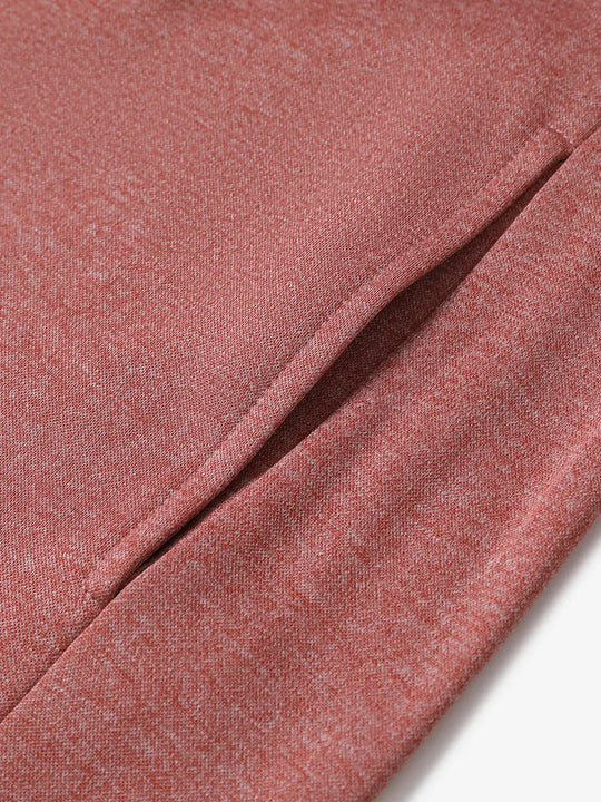 Pocket detail of Brick Heather hoodie showing practical side pocket with clean stitching finish