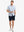 Full-body front view holding a takeaway drink cup, wearing DREAMY STARRY SKY Stylish Printing Summer Shirt.