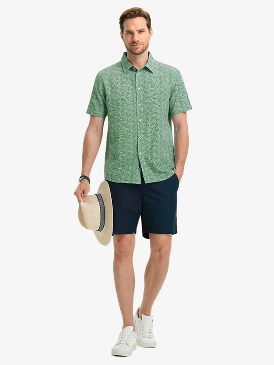Full-body front view holding a takeaway drink cup, wearing GREEN SMALL LEAF Stylish Printing Summer Shirt.