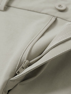 Detail view of the zipper on the khaki grey youth water resistant cotton blend golf pants, highlighting secure closure