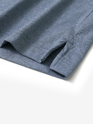 Hem detail of Skin-friendly long sleeve melange polo with neat stitching in demin blue heather