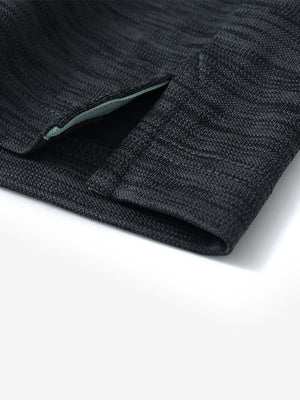 Close-up of hem slit detail on DARK GREYBLACK HEATHER Cool Heather Texture Polo