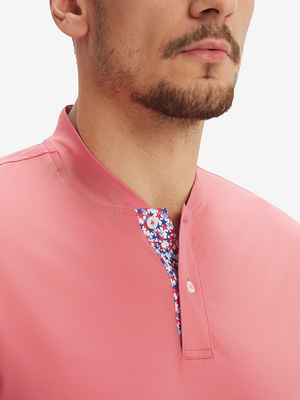 Close-up of model in brick red moisture-wicking short sleeve henley shirt, nose to chest front view.