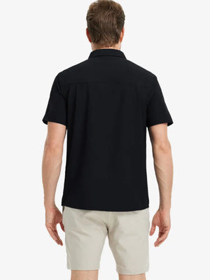 Half-body back view displaying the clean lines of the BLACK polo.