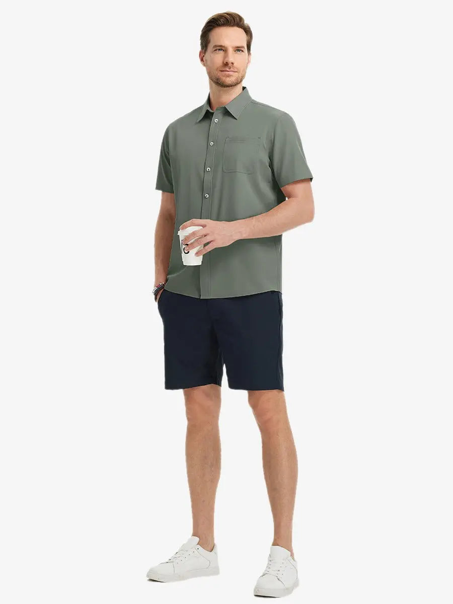 Detail shot with model holding a takeaway drink, featuring the OLIVE GREEN polo’s side vent.