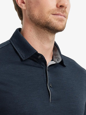 Close-up of Modern Fit Melange Polo front (nose to chest) in NAVY HEATHER, showing rich melange texture.