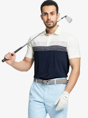 Half-body front shot holding golf club in NAVY Premium Performance Polo