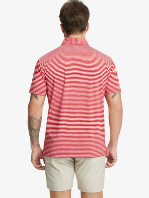 Back half-body shot of model showcasing the back of Sport Fit Stripe Polo in Red Stripe